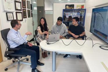 Dr. Antoni Ribas going over B2M/MHC class I data with Mildred Galvez and lab members Egmidio Medina and Justin Saco.