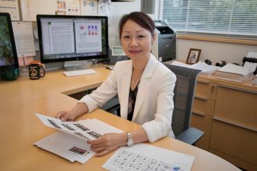 Headshot of Lili Yang at her desk