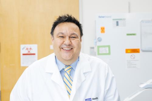 Steven Jonas smiles in a UCLA lab.