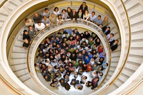 Members standing in stair well.