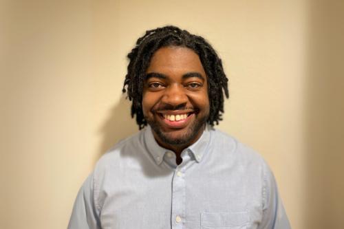 Researcher D'Juan Farmer smiles for a headshot