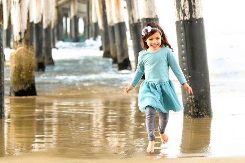 Photograph of Evangelina Vaccaro running at the beach