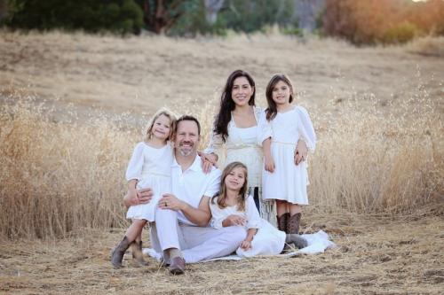 Family photo: Christian and Alysia Padilla-Vaccaro with daughters Gigi (left), Annabella (seated) and Evangelina. Evangelina was born with a rare genetic immunodeficiency disorder, but thanks to a novel gene therapy at UCLA, her immune system was restored.