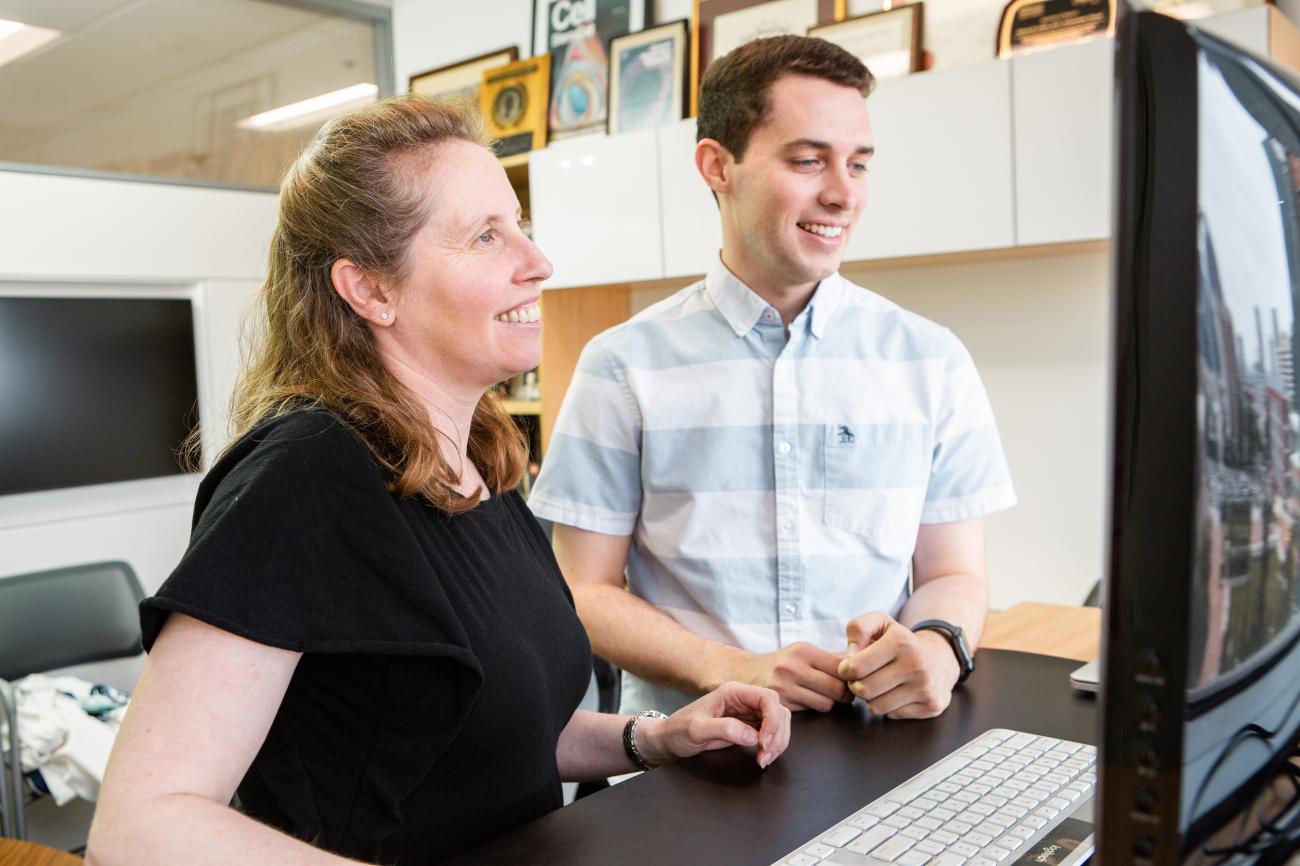 Dr. Brigitte Gomperts and Cody Aros in a Lab