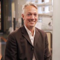 Researcher Alexander Hoffman smiles for a photograph.