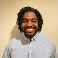 Researcher D'Juan Farmer smiles for a headshot