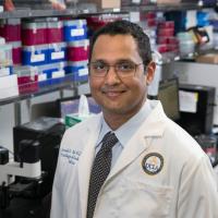 Researcher Dinesh Rao smiles for a photograph